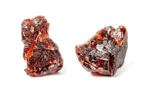 Macro mineral stone Garnet Spessartine on a white background photo