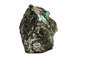 Macro emerald stone mineral in rock on white background photo
