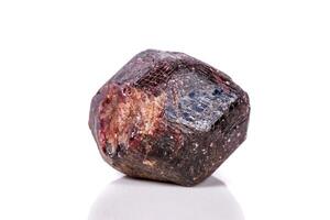 Macro of a mineral garnet stone on a white background photo