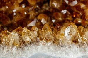 Macro mineral stone Citrine on a black background photo