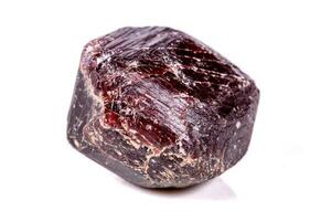 Macro of a mineral garnet stone on a white background photo