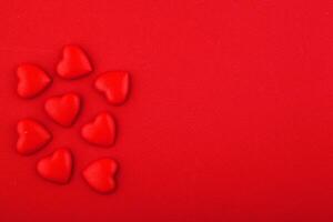 red hearts on a red background photo