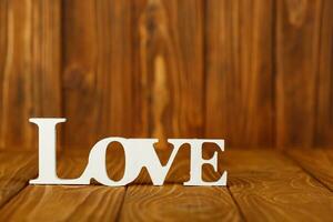 wooden inscription I love you on a wooden background photo