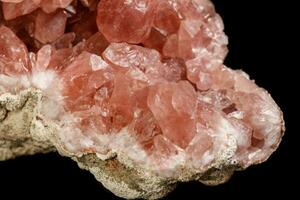 Macro mineral stone Pink Amethyst on a black background photo