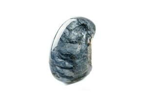 Macro mineral quartz stone with dumortierite on a white background photo