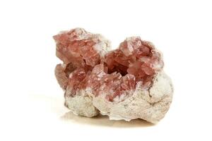 Macro mineral stone Pink Amethyst on a white background photo