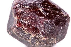 Macro of a mineral garnet stone on a white background photo