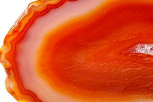 Macro mineral orange agate in crystals on white background photo