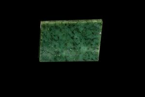 Nephrite mineral stone macro on a black background photo