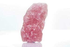 macro mineral stone rose quartz on a white background photo