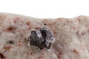 macro mineral stone Cassiterite on a white background photo