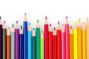 macro multicolored pencils on a white background photo