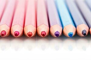 macro multicolored pencils on a white background photo