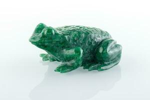 beautiful figurine of a toad made of malachite on a white background photo