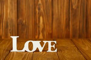 wooden inscription I love you on a wooden background photo