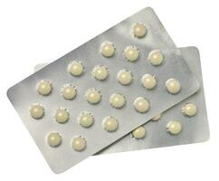 Blister pack with round pills on a white isolated background photo