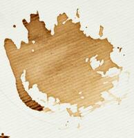 Spilled black coffee on a white background, blot photo