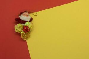 Christmas decoration on red and yellow background. Top view with copy space photo