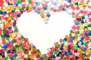 a heart shaped frame made of many colored hearts photo