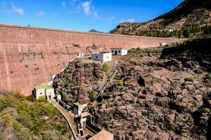 the dam is located on the edge of a cliff photo