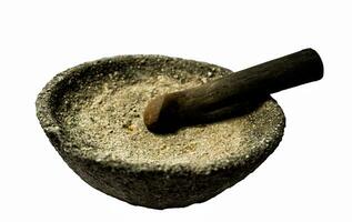 Granite mortar and pestle isolated on a white background. photo