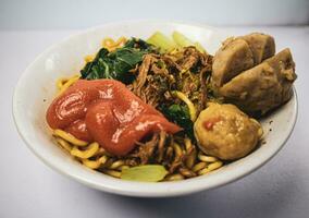 chicken noodle meatball or mie ayam bakso. one of the most popular noodle dishes in Indonesia photo