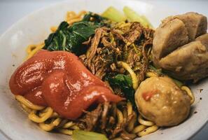 chicken noodle meatball or mie ayam bakso. one of the most popular noodle dishes in Indonesia photo