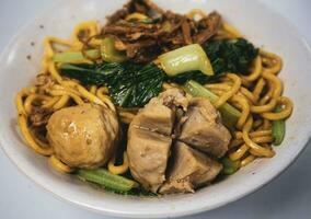 chicken noodle meatball or mie ayam bakso. one of the most popular noodle dishes in Indonesia photo