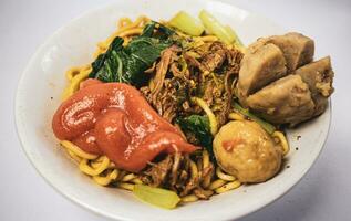 chicken noodle meatball or mie ayam bakso. one of the most popular noodle dishes in Indonesia photo