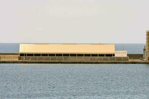 a large building sitting on the water photo