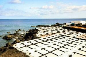 a large area of concrete blocks on the beach photo