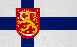 Flag and coat of arms of Republic of Finland on a textured background. Concept collage. photo