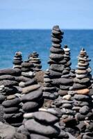stacked rocks on the beach photo