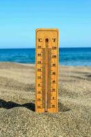 a thermometer on the beach photo