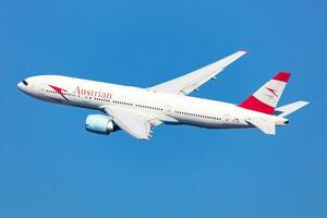 Austrian Airlines Boeing 777-200 passenger plane at airport. Aviation and aircraft. Air transport and travel. Transportation. Fly and flying. photo