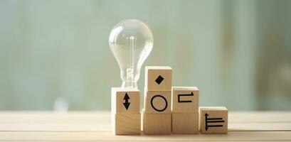 AI generated Creative idea, solution and innovation concept. Idea generation for business development. Wooden cube blocks with light bulb and cycle icons on clean background and copy space. photo