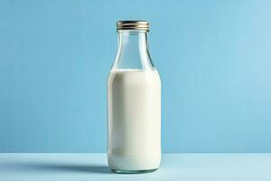 AI generated A glass bottle with full milk on blue background. photo