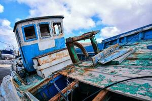 an old boat with damaged paint photo