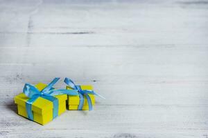 Gift boxes on wooden table. Collection of gift boxes on wooden board holidays concept. Presents for any holiday concept photo