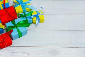 Gift boxes on wooden table. Collection of gift boxes on wooden board holidays concept. Presents for any holiday concept photo