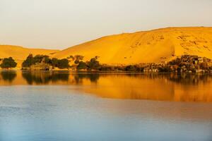 Nile the longest river in Africa. Primary water source of Egypt. Landscape with clear water river. photo