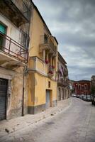 Colorful houses and streets in old medieval village Ragusa in Sicily, Italy. photo