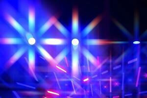 Bright multi-colored iridescent lights of stage lighting. Background scene, performance. Concert light. photo