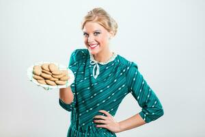 Retro housewife made delicious cookies photo