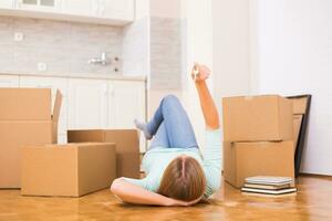 Woman holding key of her new home. photo