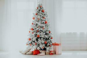 Christmas interior stock photos. Explore warm and inviting holiday themed home settings, adorned with twinkling lights, stockings, and beautifully decorated Christmas trees. photo