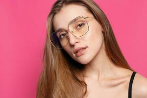 Close up shot of stylish young woman in sunglasses smiling photo