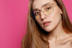 Close up shot of stylish young woman in sunglasses smiling photo