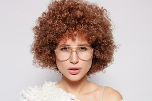 Portrait of smiling young woman with afro hairstyle photo