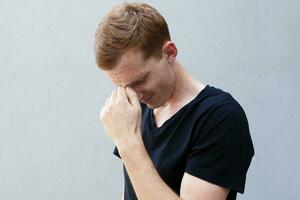 Close up portrait of a redhead of a beautiful manly guy with freckles photo